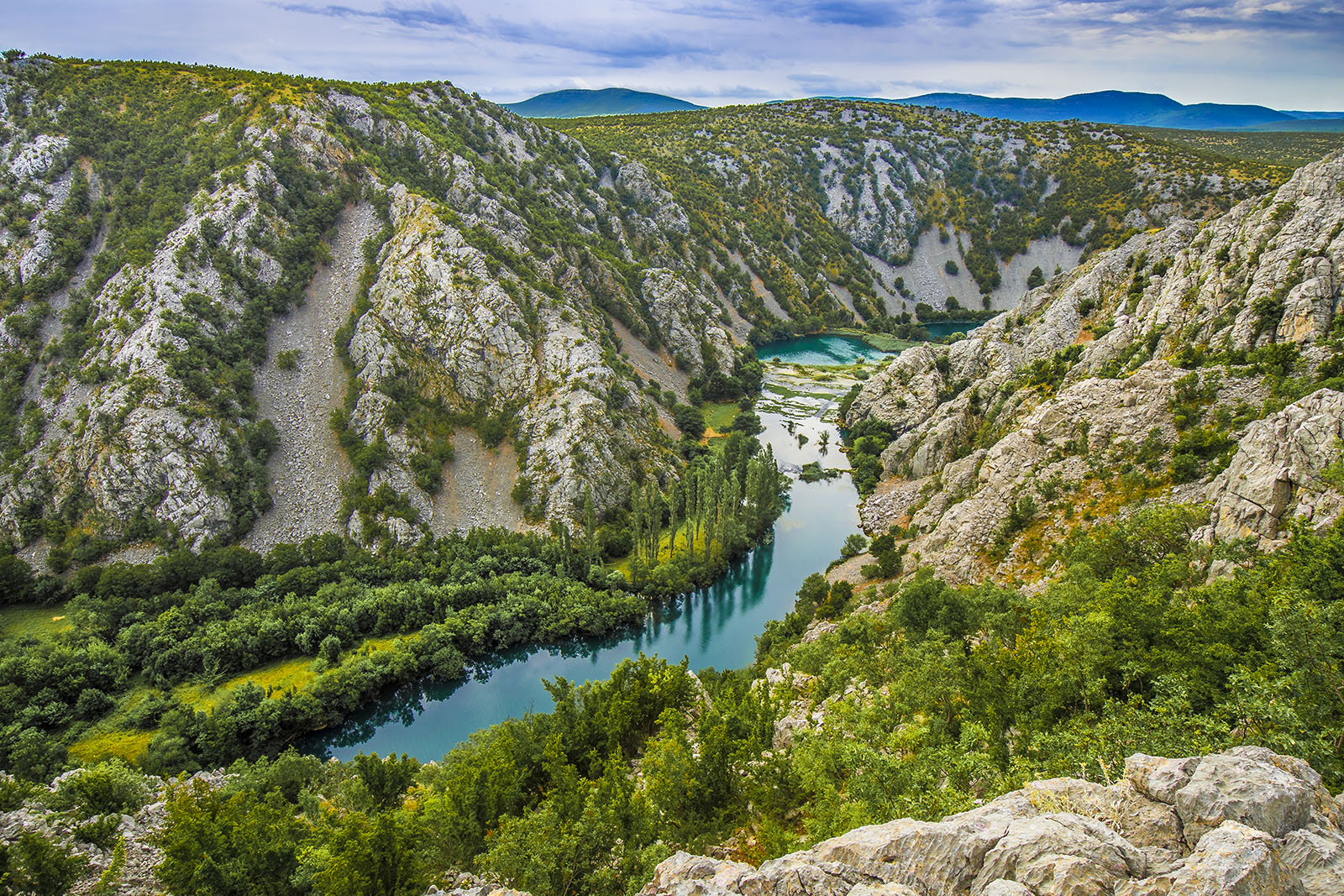 River canyon snaking through hills.
