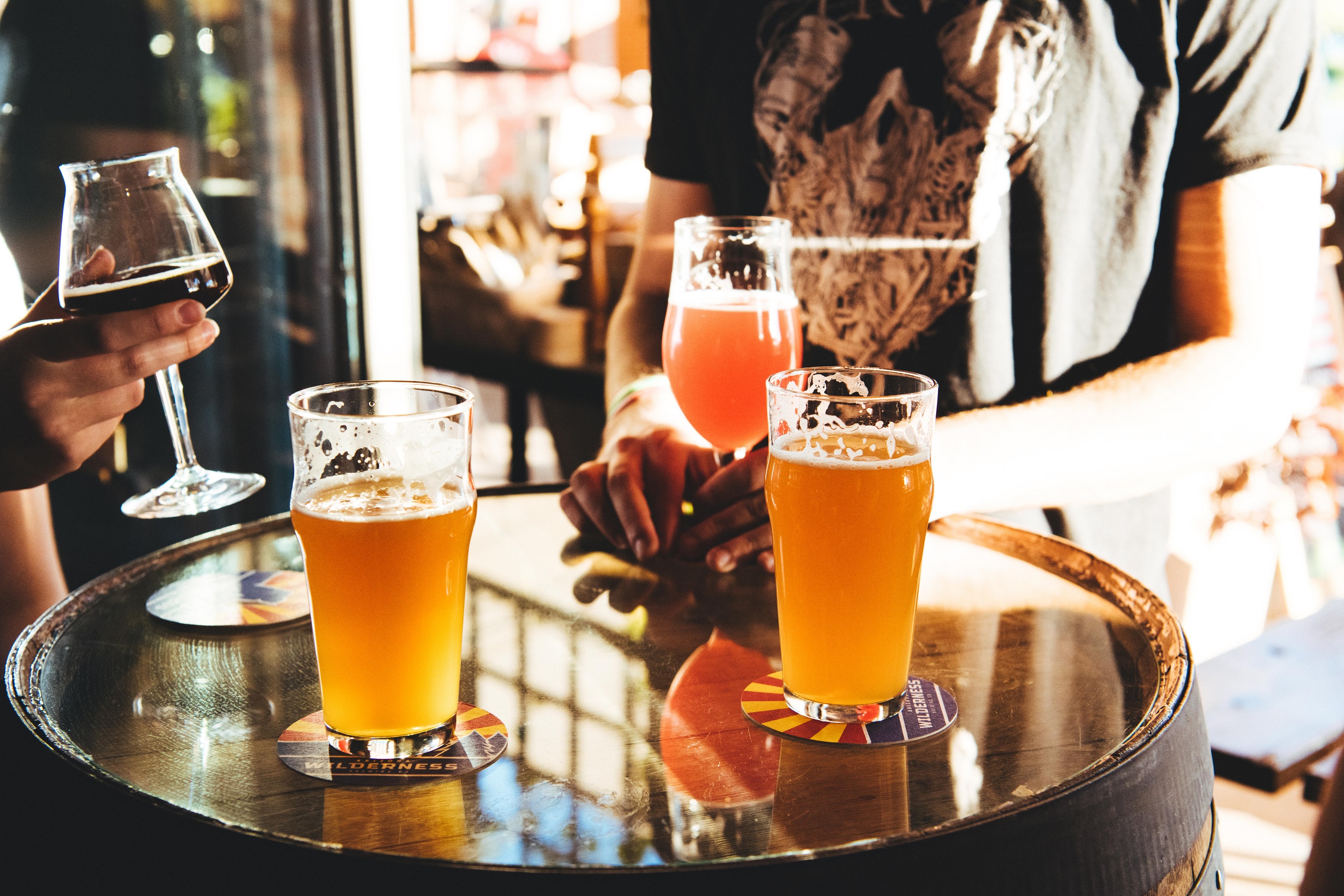 Glasses of beer on a table at Arizona Wilderness Brewing in Gilbert, Arizona.