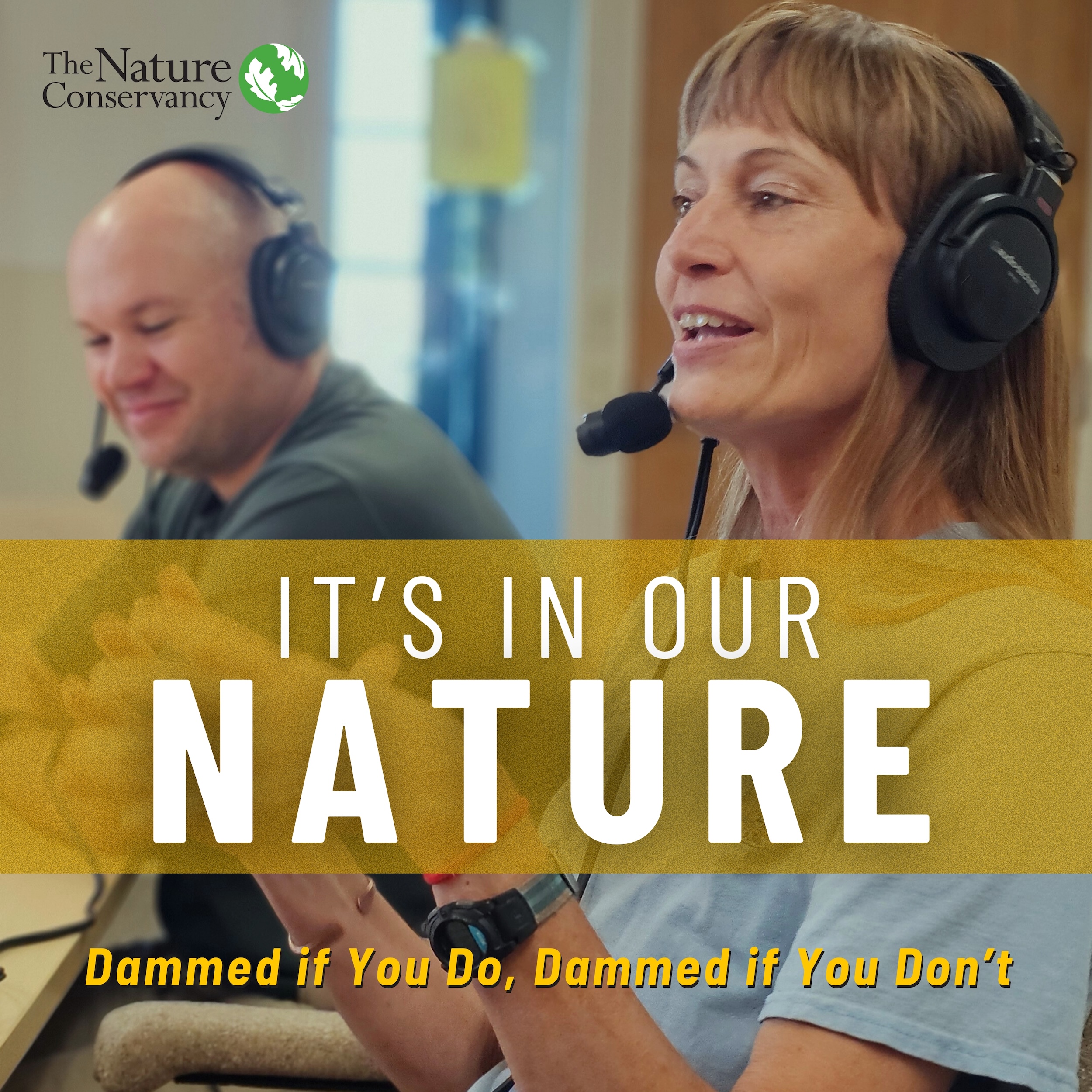 A man and a woman wearing microphone headsets sit in a recording studio.