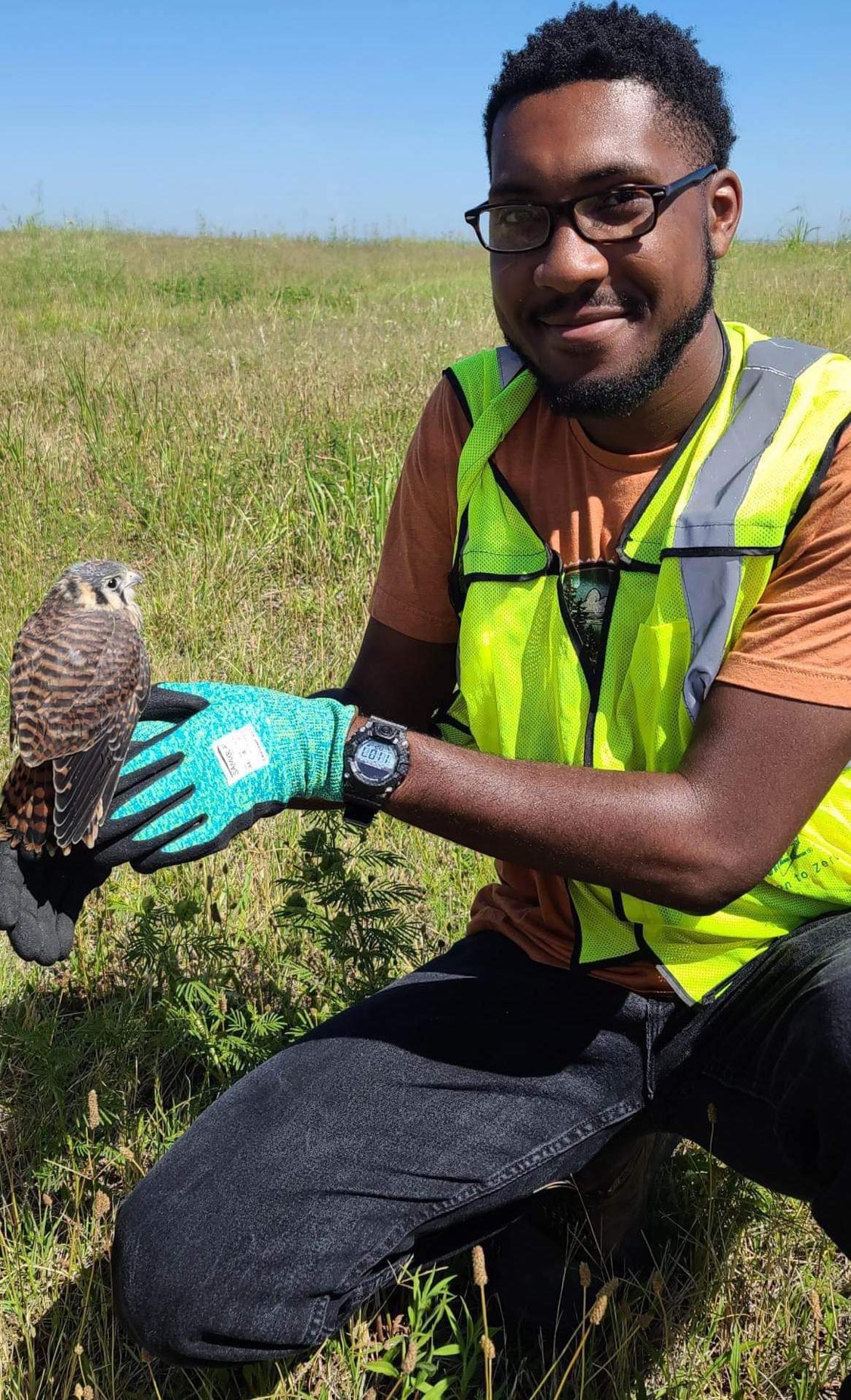 Photo of Derrick Mason holding a hawk.