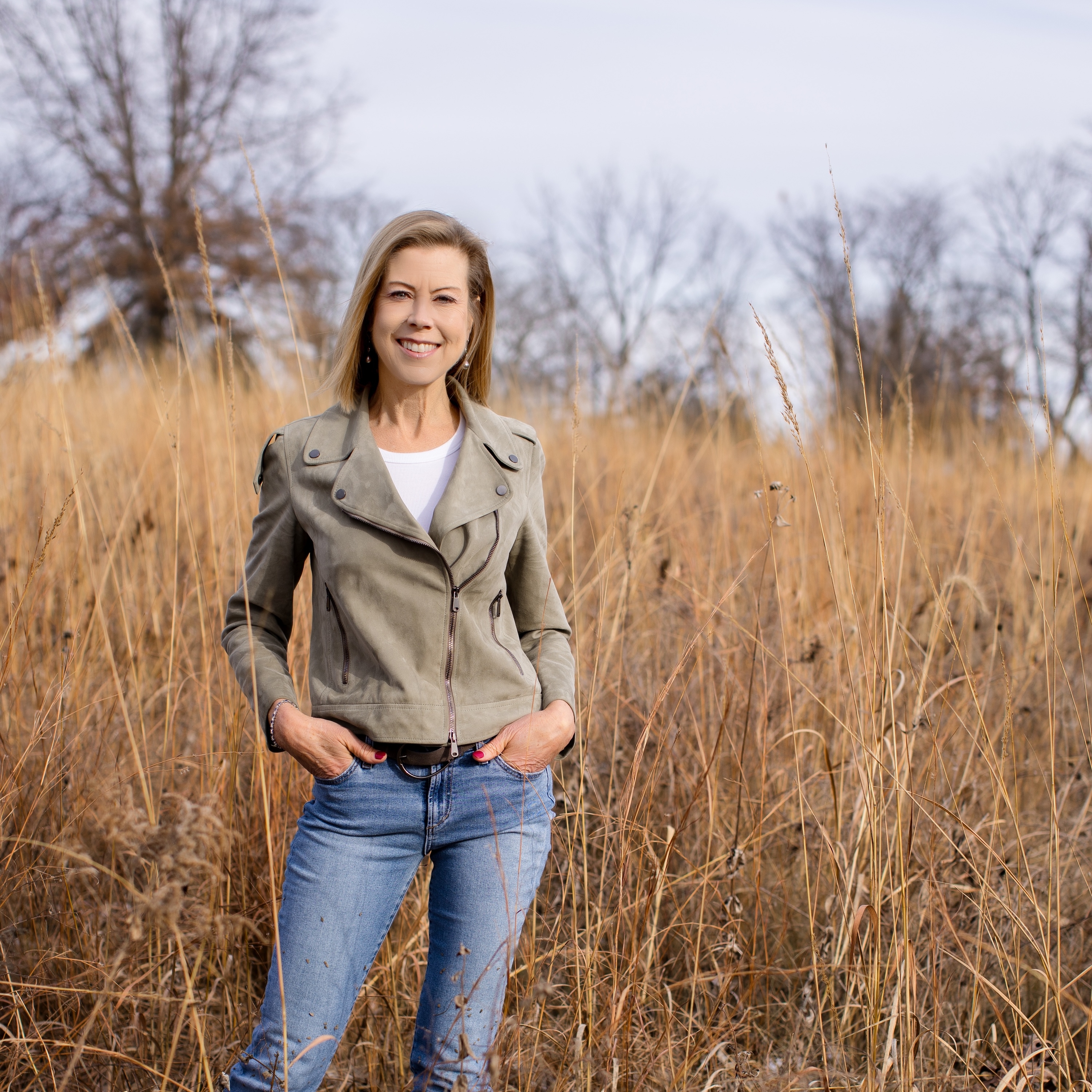 Iowa Board Chair Sharon Krause stands in an Iowa field.