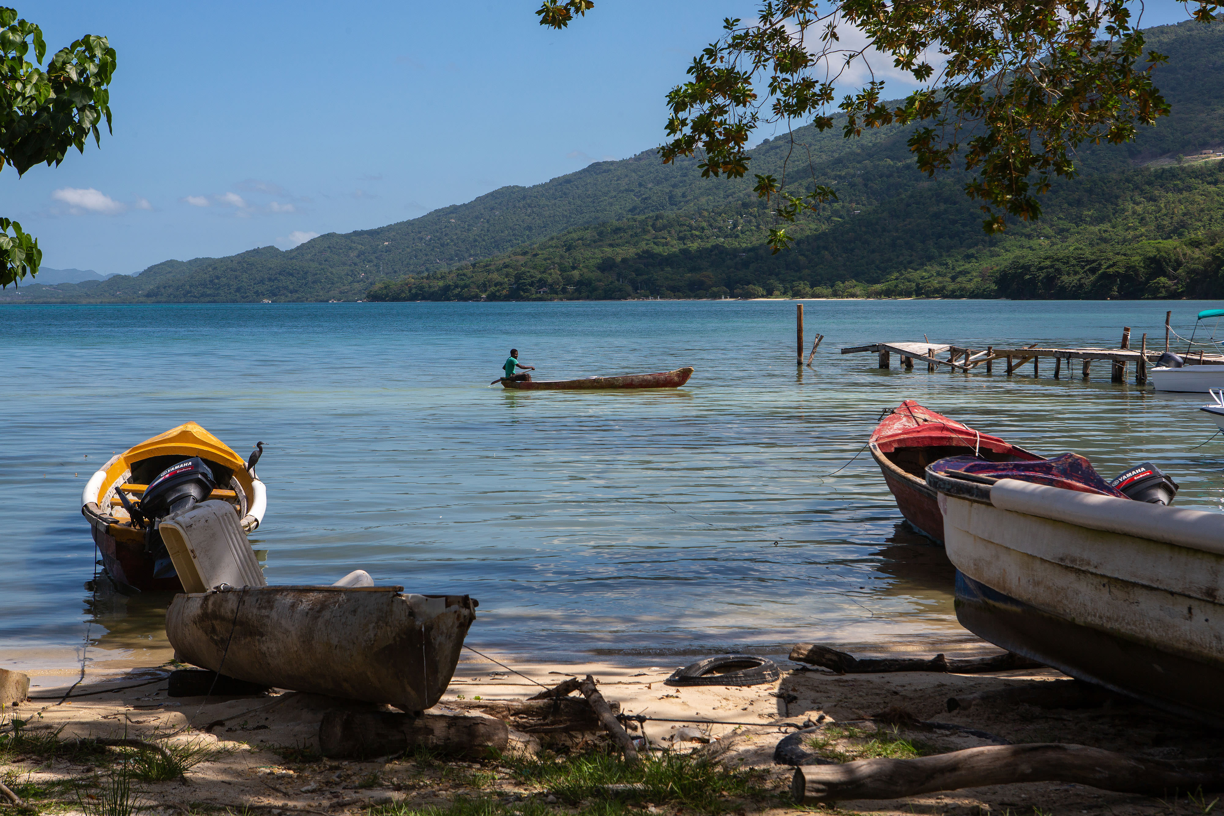 Fishing boats along a coast in Pedro Cays, Jamaica