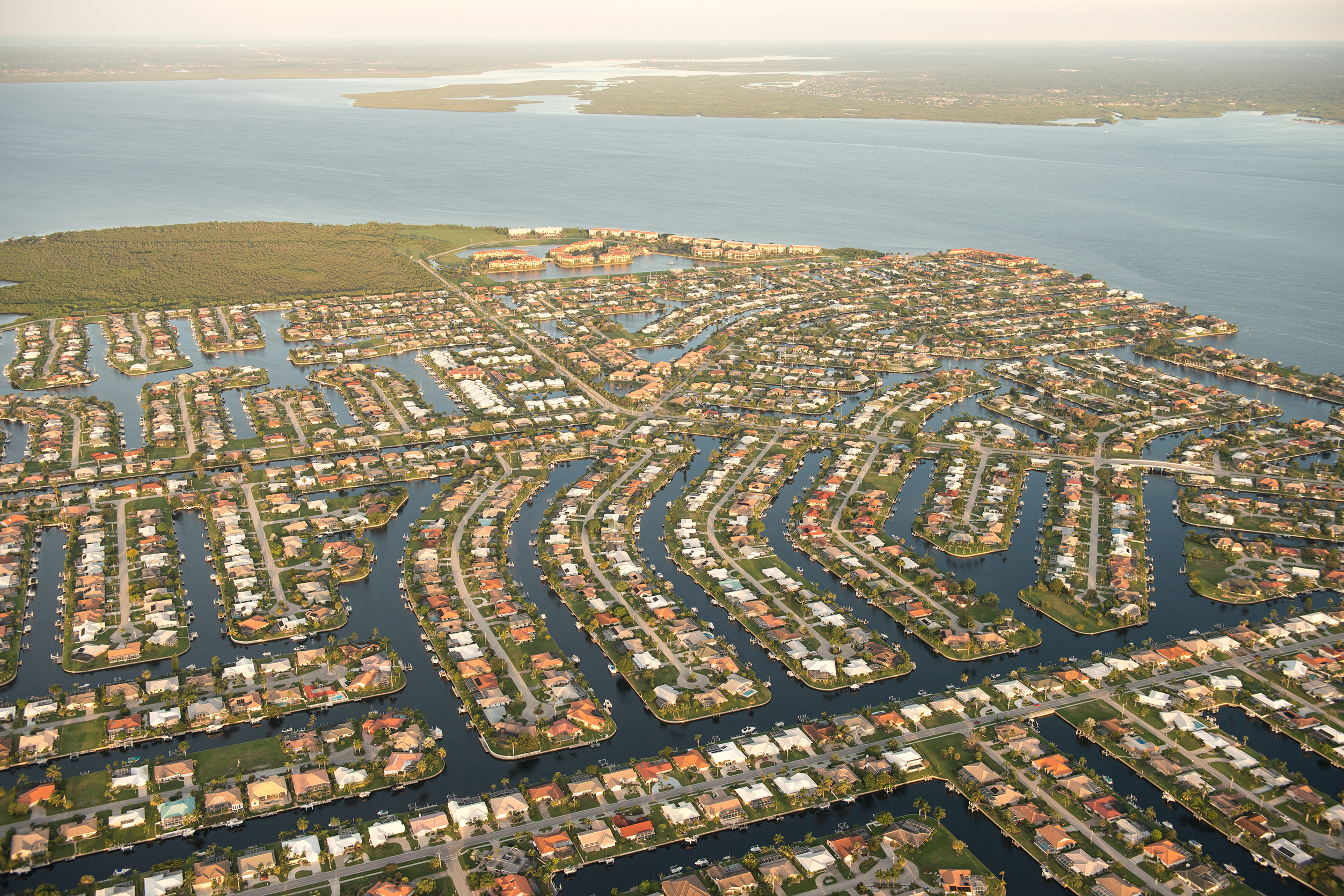 Aerial view of dense sea-side development.