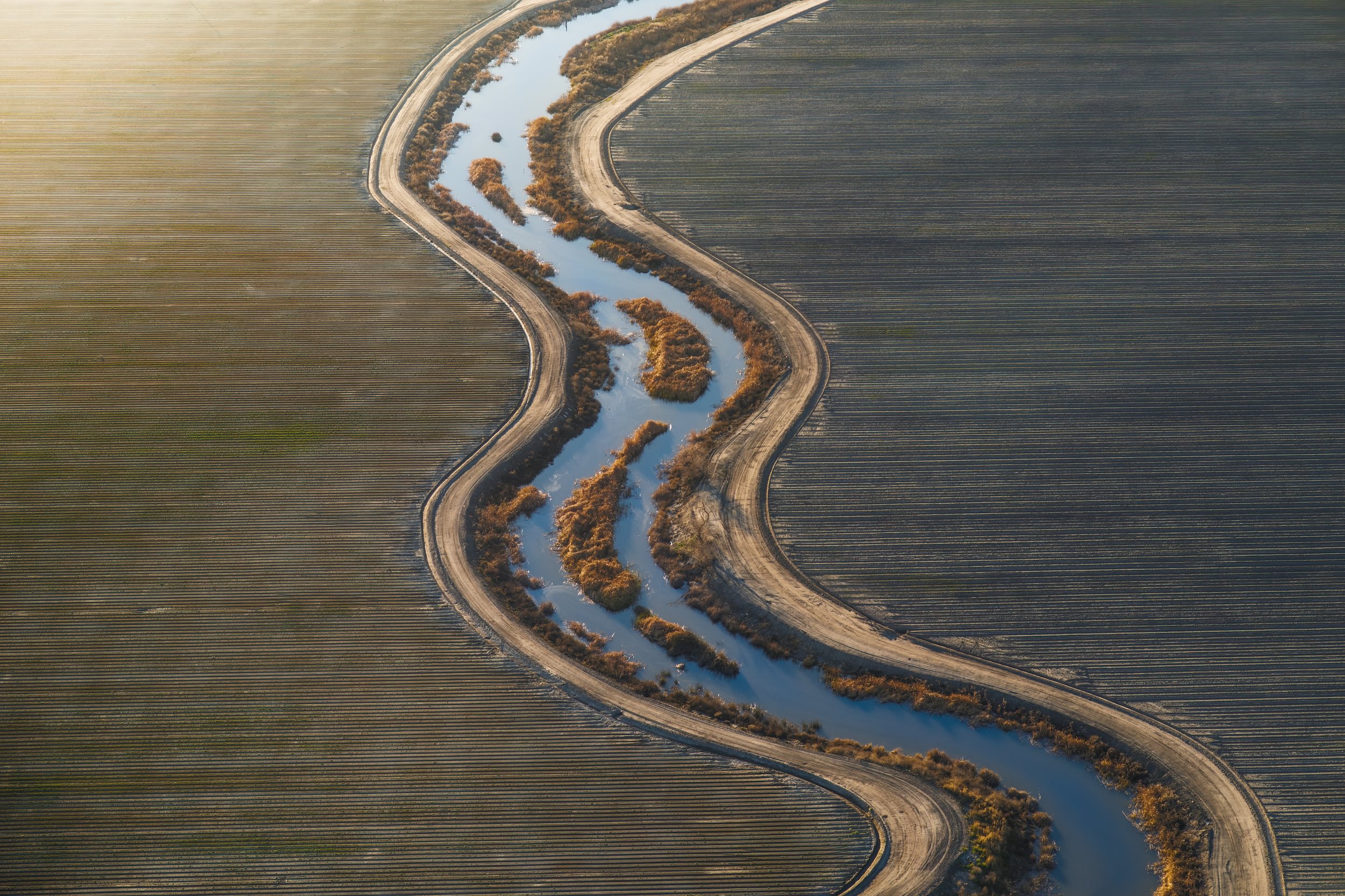 Aerial view of a bending river.