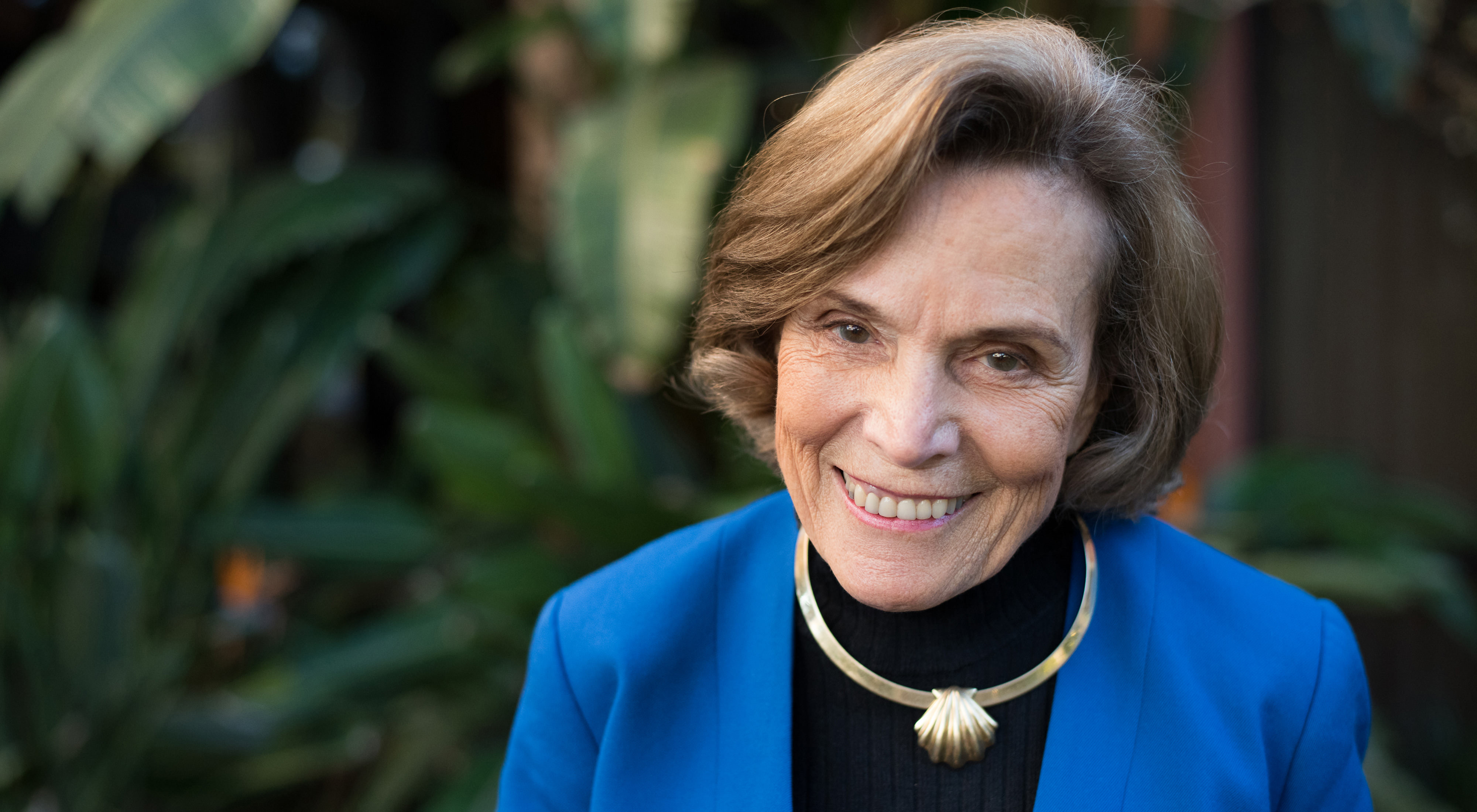 Sylvia Earle, a woman with a blue suit jacket and warm smile. 